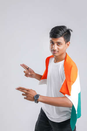 Young indian man with indian flagの写真素材