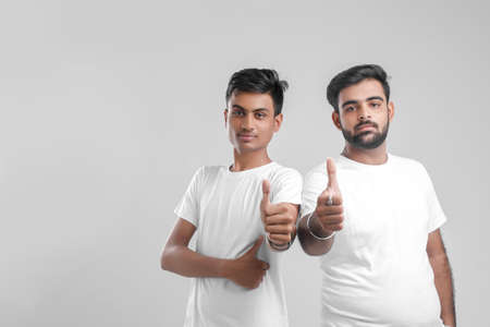 young indian college students showing thumbs up.の写真素材