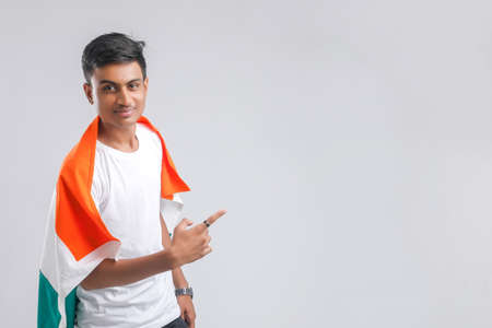 Young indian man with indian flag