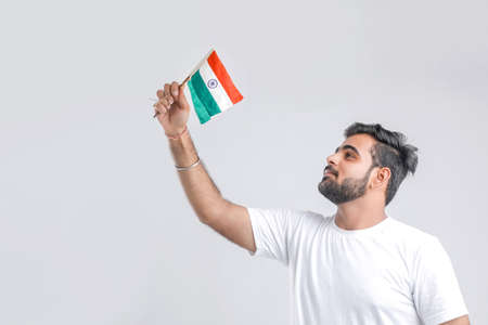 Young indian man with indian flagの写真素材