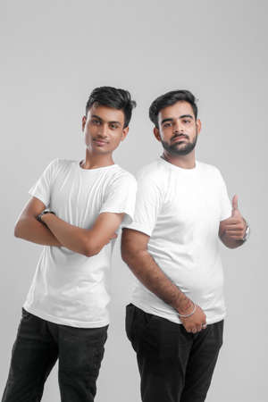 young indian college students showing thumbs up.の写真素材