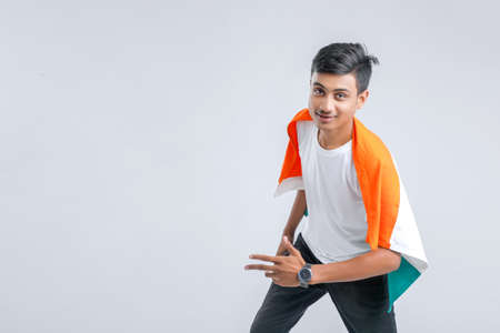 Young indian man with indian flagの写真素材