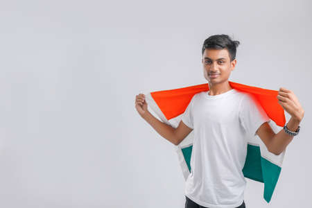 Young indian man with indian flagの写真素材