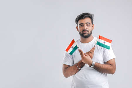 Young indian man with indian flagの写真素材