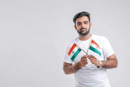 Young indian man with indian flagの写真素材