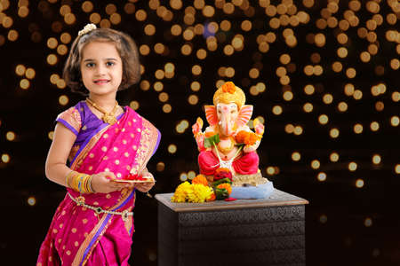 Little indian Girl with lord ganesha