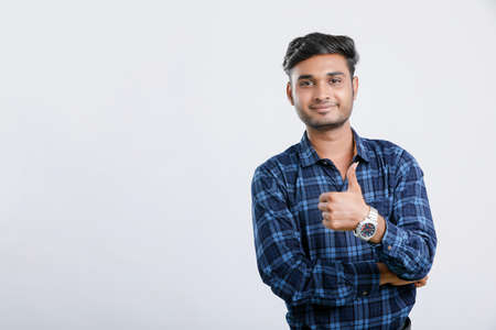 young indian man showing thumps upの写真素材