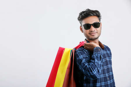 young indian man with shopping bags, Indian festivalの写真素材