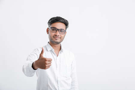 young indian man showing thumps upの写真素材