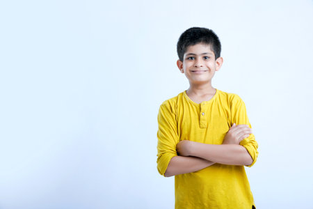 young indian child giving multi expressions over white backgroundの写真素材