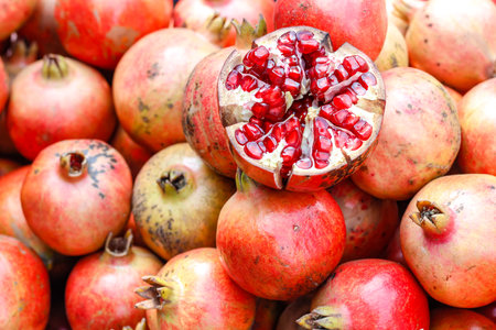A bunch of whole ripe pomegranates.の写真素材