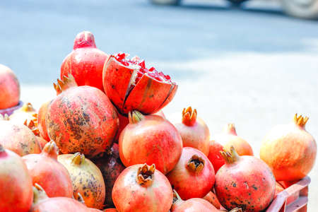 A bunch of whole ripe pomegranates.