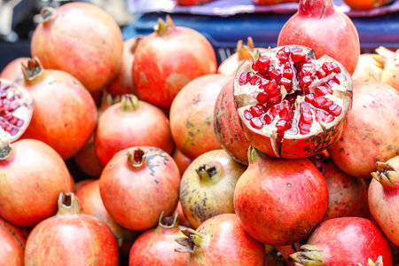 A bunch of whole ripe pomegranates.の写真素材
