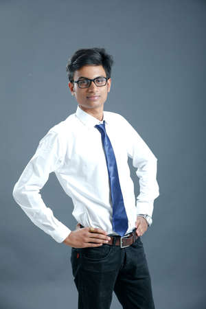 young indian employee wear spectacles and giving expression
