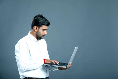 young indian businessman using laptopの写真素材