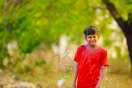 Holi celebrations - Splash of colorful water on Holi festival.
