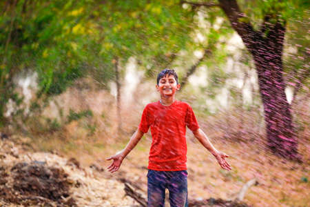 Holi celebrations - Splash of colorful water on Holi festival.