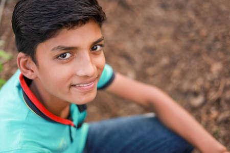 cute indian child at agriculture field