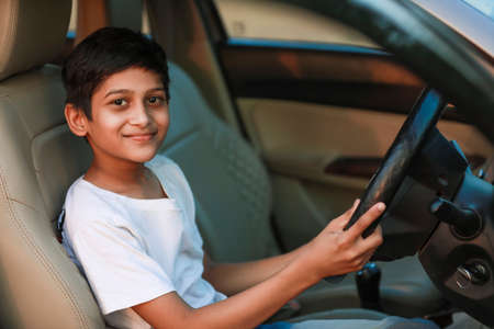 Cute Indian child in car