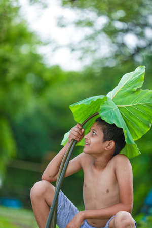 Cute indian little child enjoying with nature