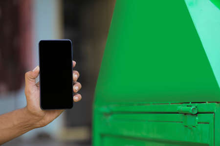 Man showing Smart phone with blank screenの写真素材