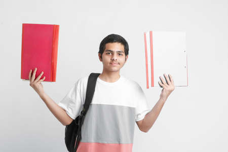 College Boy holding with file in hand on white background.