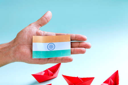 Concept of independent day or republic day of India : tricolor flag with hand