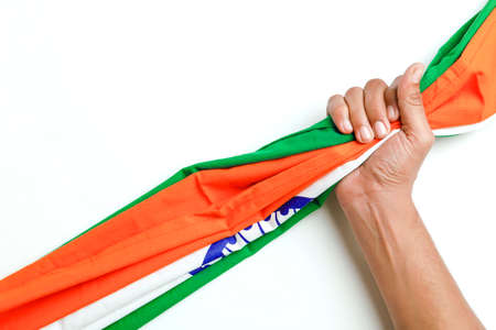 Concept of independent day or republic day of India : tricolor flag with handの写真素材