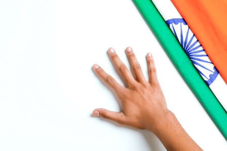 Concept of independent day or republic day of India : tricolor flag with handの写真素材
