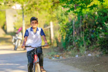 indian / Asian little boy enjoy cycle ridingの写真素材