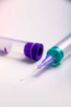 blood sample tube with injection syringe concept of corona protection.
