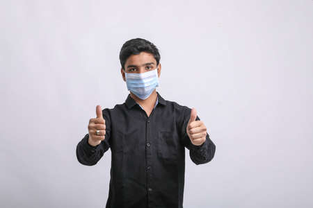 Young man wearing protective maskの写真素材