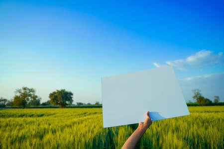 empty cardboard in farmer hand, agricultural background.の写真素材