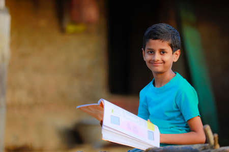 Cute indian child studying at homeの写真素材