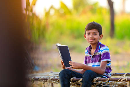 Rural Indian Child Playing Cricket.の写真素材