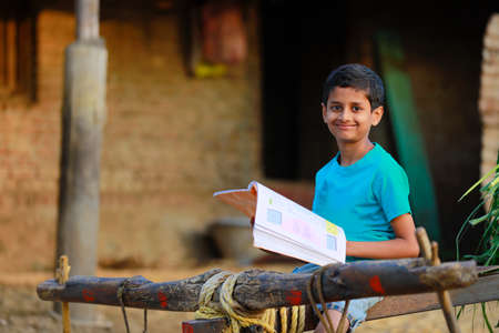 Cute indian child studying at home