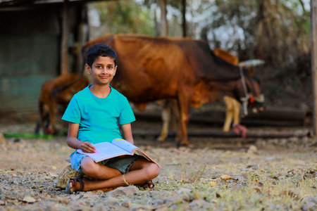 Cute indian child studying at homeの写真素材