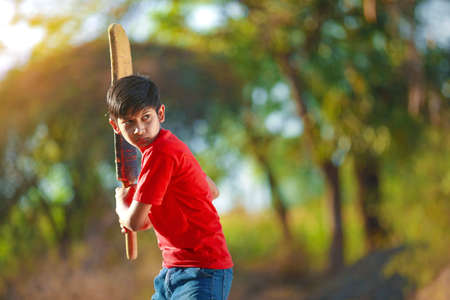 Rural Indian Child Playing Cricketの写真素材