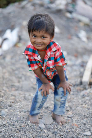 Jalgaon, Maharashtra /India-August 12, 2019 : Poor Indian child smile and showing multi pal expressionのeditorial素材