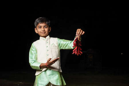 Jalgaon, Maharashtra /India-August 12, 2019 : Poor Indian child smile and showing multi pal...