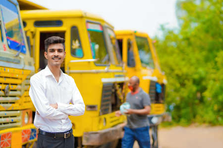 Young indian businessman with his freight forward lorry or truck.の写真素材