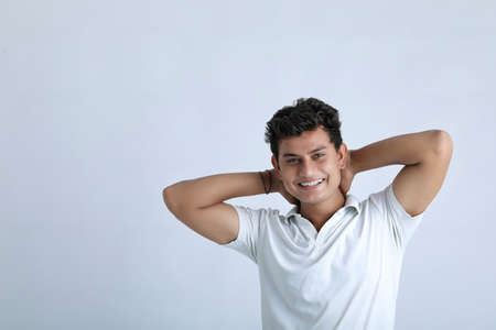 Young indian college student showing expression on white backgroundの写真素材