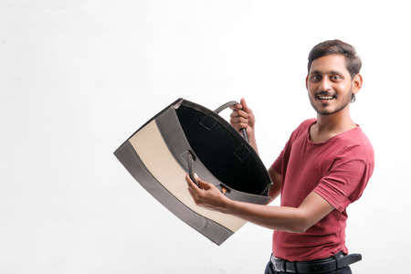 Young indian man showing excitement with shopping bags