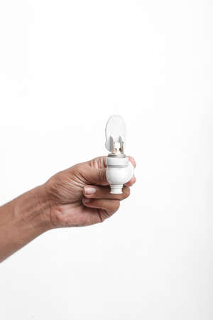 Water tap in hand on white background.