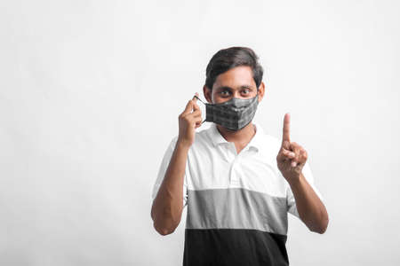 young indian man wearing mask for protection against virus.の写真素材