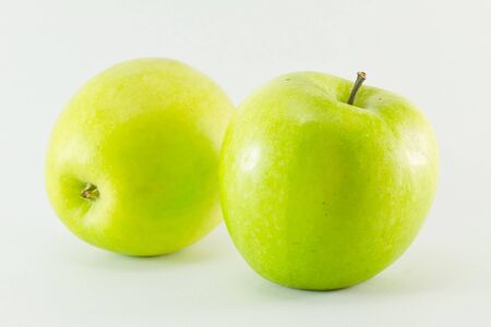 Two green apples isolated on white backgroundの写真素材