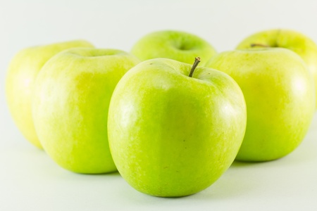 Green apples isolated on white backgroundの写真素材