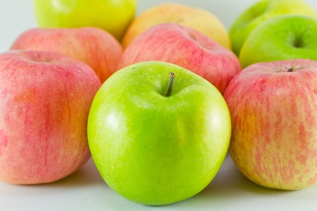 Green and red apples on white backgroundの写真素材