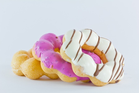 Three colorful donuts on white backgroundの写真素材