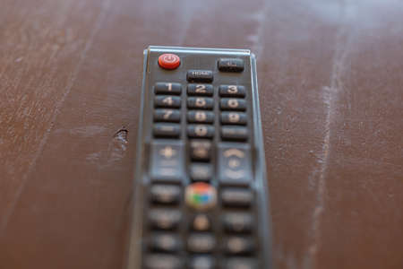 Focus at red keypad of remote control and softbrue on keypadの写真素材